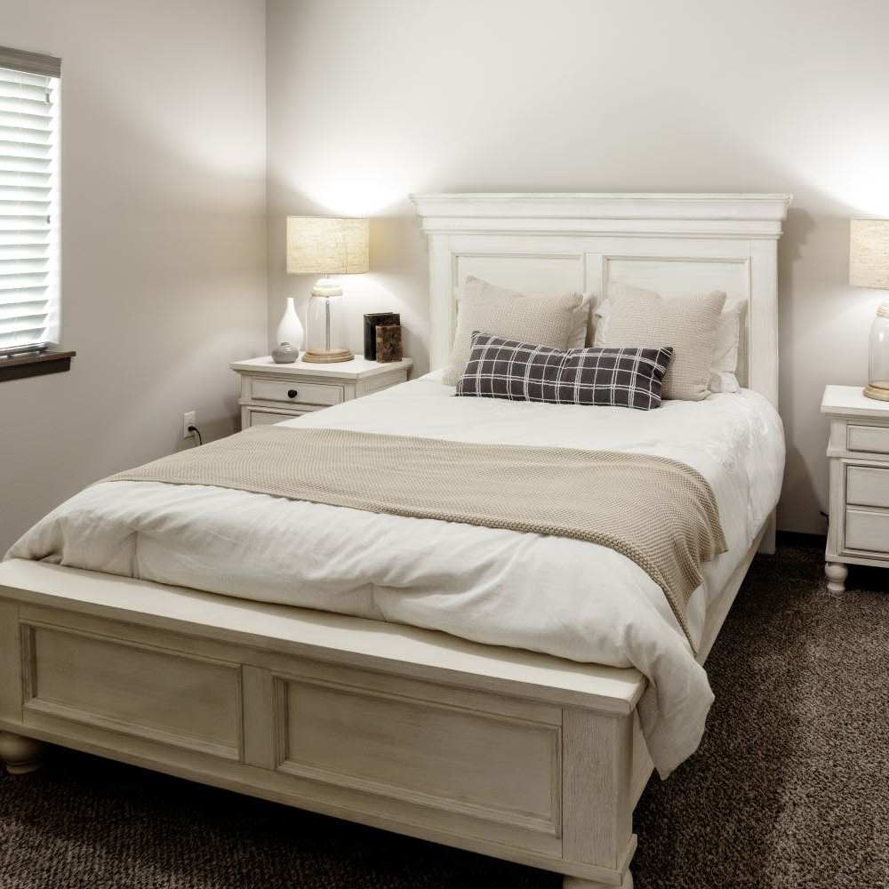 Bedroom with a comfortable bed at InterUrban Apartments in Billings, Montana
