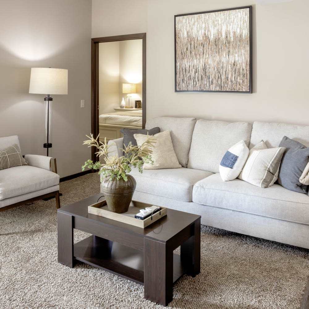 Living room with beautiful wall art at InterUrban Apartments in Billings, Montana