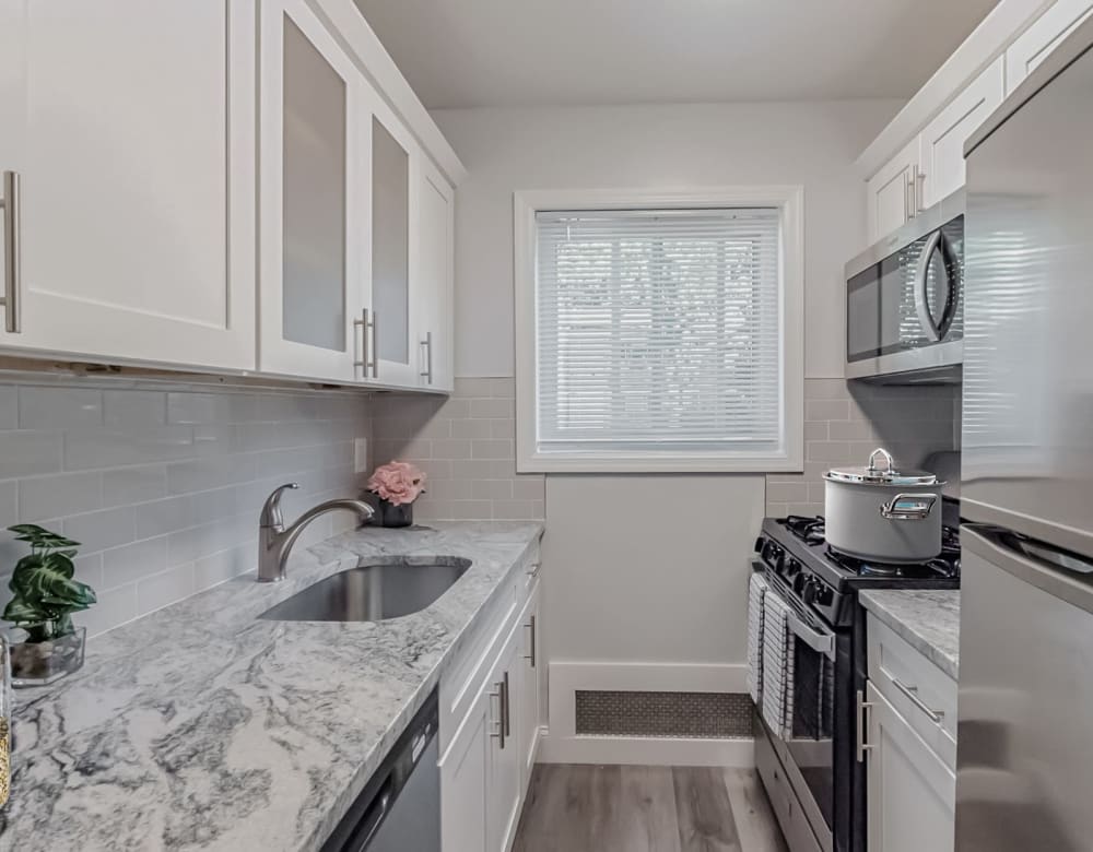 Galley style kitchen at Eagle Rock Apartments at Nesconset in Nesconset, New York