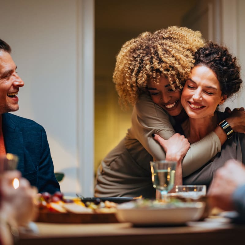 Residents host a family dinner at Infinity at Centerville Crossing, Virginia Beach, Virginia