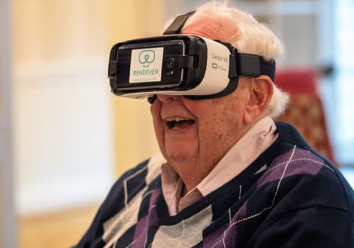 Senior having fun with VR headset at Maplewood Senior Living
