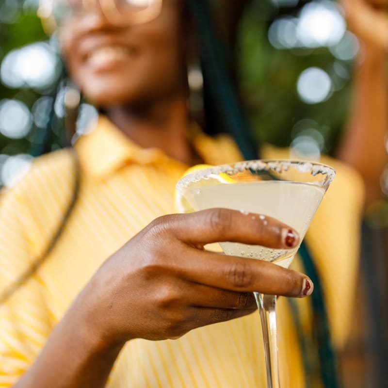 A resident enjoys a cocktail near at Windsong, Virginia Beach, Virginia