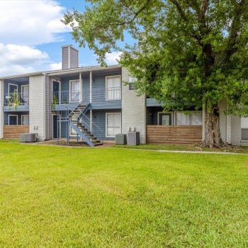 Grass between apartment buildings at Westbury Crossing in Houston, Texas