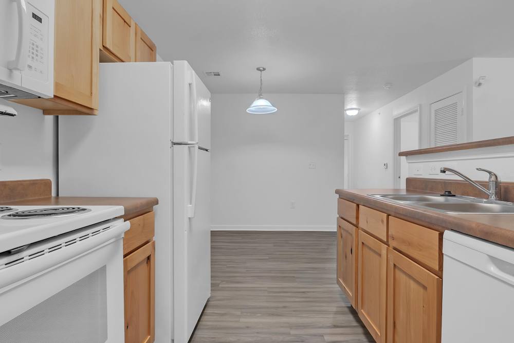 Upgraded kitchen with modern appliances and spacious layout at Wickham Gardens in Sapulpa, Oklahoma