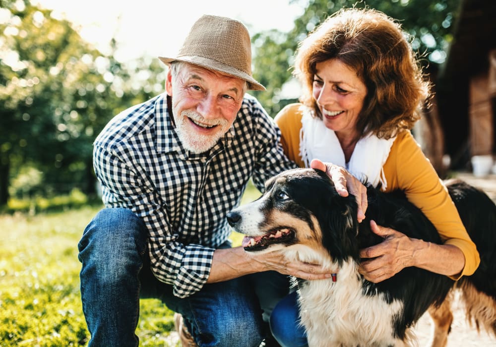 Residents enjoy their new home with their dog at LARC at Burien in Burien, Washington