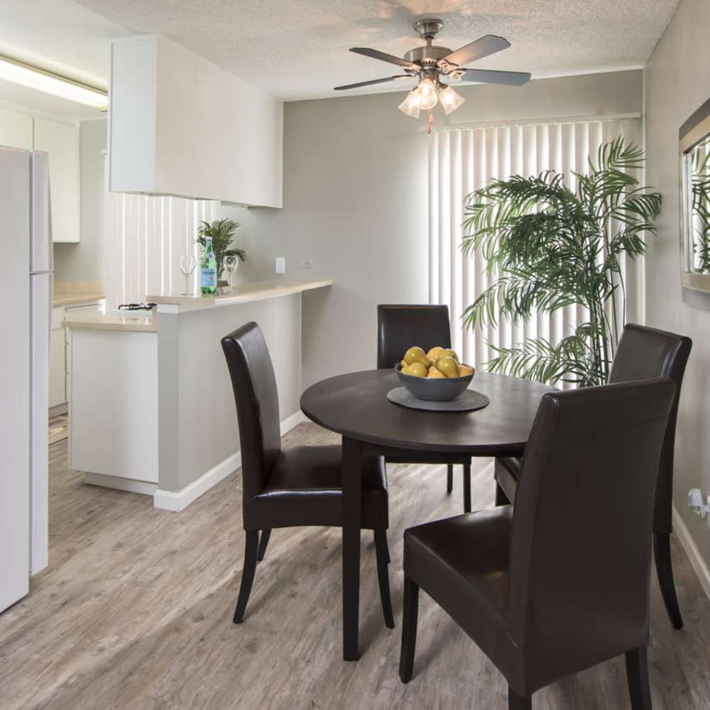 Kitchen with connected dining space of a modern apartment at Lawrence Road Apartments in Santa Clara, California, 
