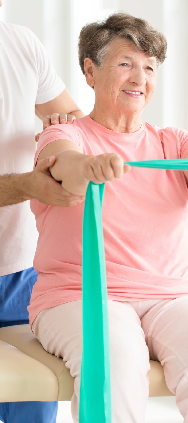 Resident working out with dumbbells at Geneva Lake Manor in Lake Geneva, Wisconsin