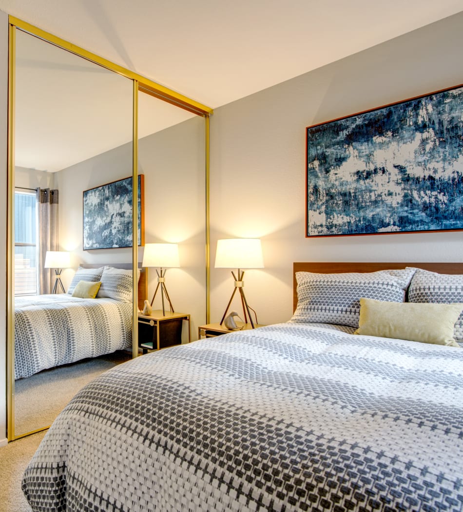View of the in-unit washer and dryer from a model home's bedroom at Terra Martinez in Martinez, California
