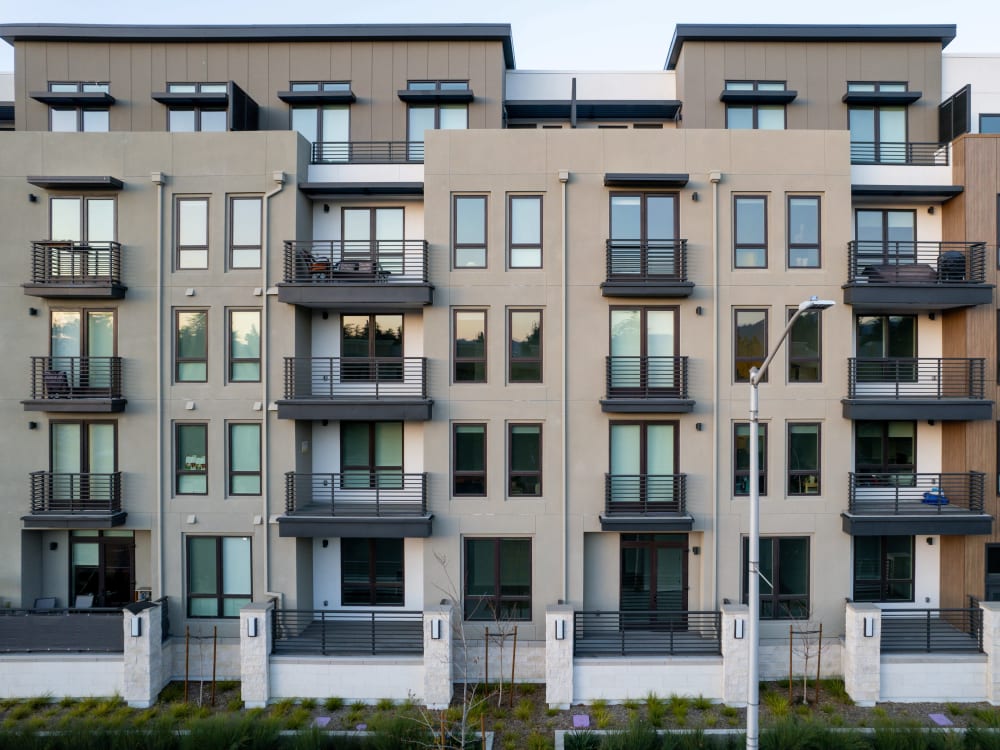 Exterior of MV Apartments with private balconies in Mountain View, California