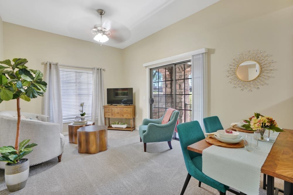 Living room and dining area of a resident apartment with furnishings at Tuscany at McCormick Ranch in Scottsdale, Arizona