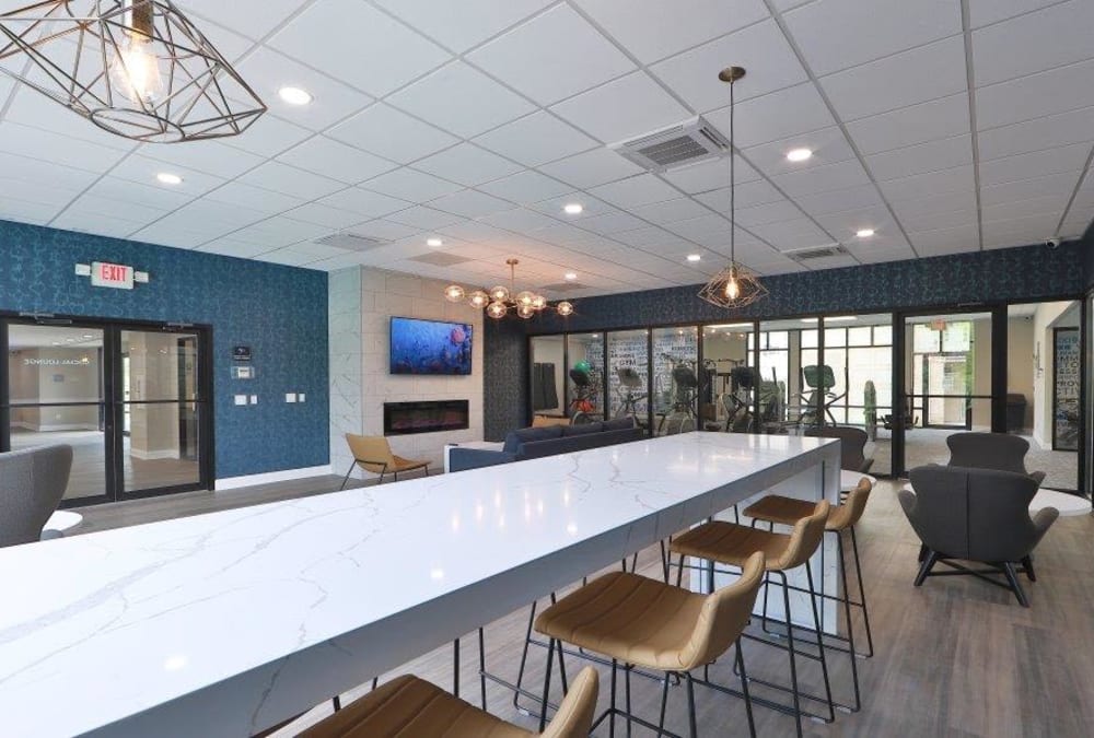 Counter seating perfect for working from home in the resident lounge at Stoneridge at Mark Center Apartment Homes in Alexandria, Virginia