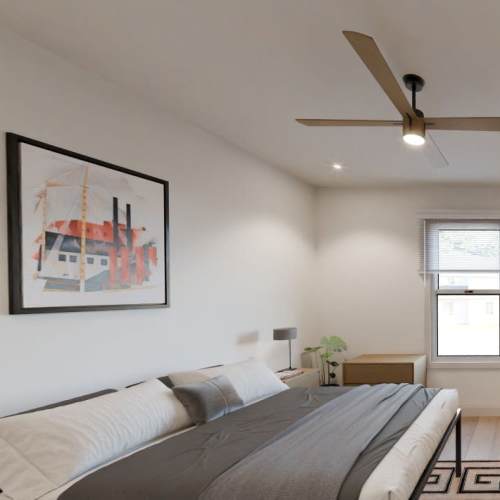 Modern bedroom with ceiling fan at Russ Town Crossing in Ruston, Louisiana