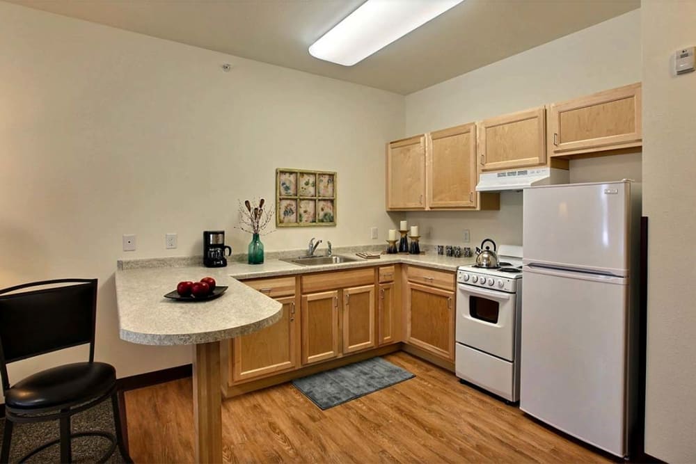 Full kitchen in resident apartment at Milestone Senior Living Woodruff in Woodruff, Wisconsin.