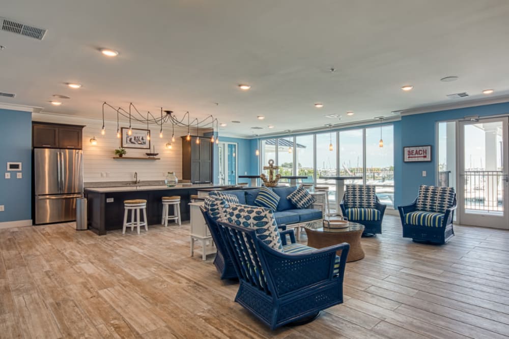 A spacious clubhouse with a view and comfortable seating at Marina Villa in Norfolk, Virginia