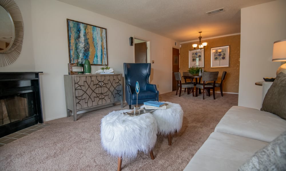 Spacious living room with plush carpeting at Sunchase Ridgeland Apartments in Ridgeland, Mississippi