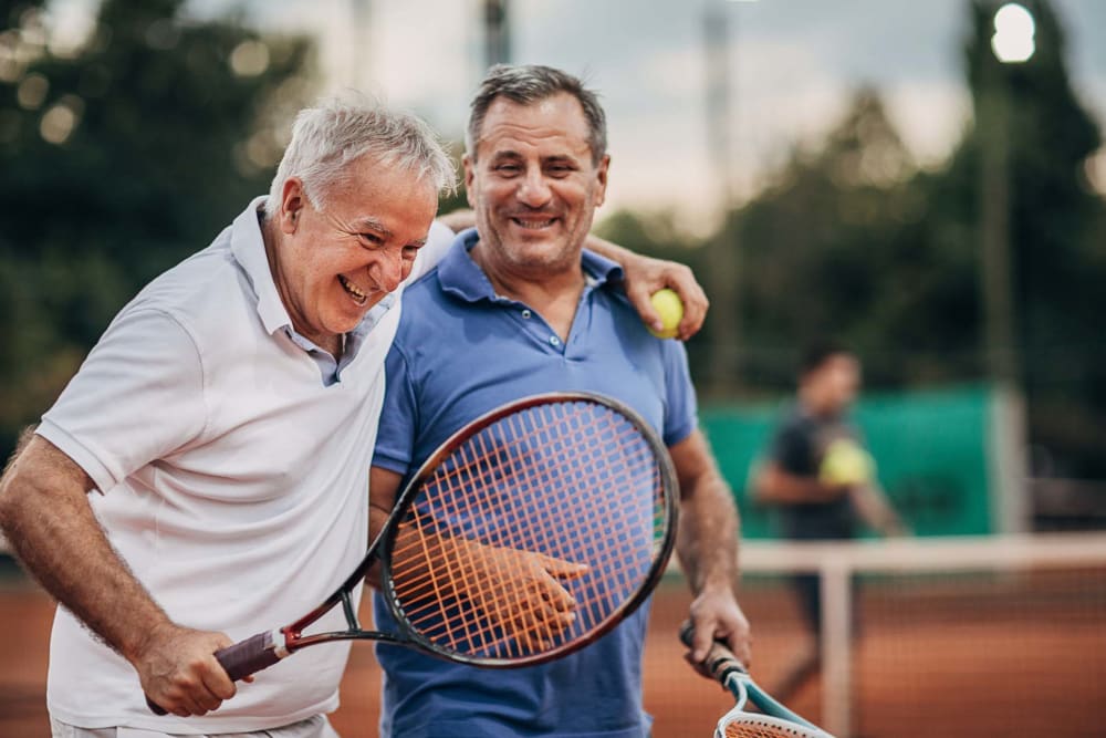 Residents playing tennis near Sunrise Villas in Los Angeles, California