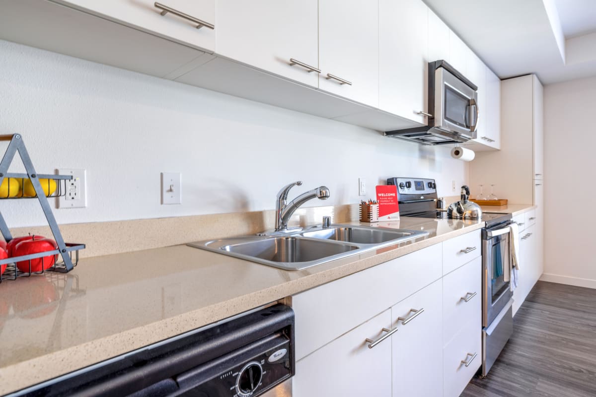 Stainlees-steel appliances in an apartment kitchen at Circa Greenlake in Seattle, Washington
