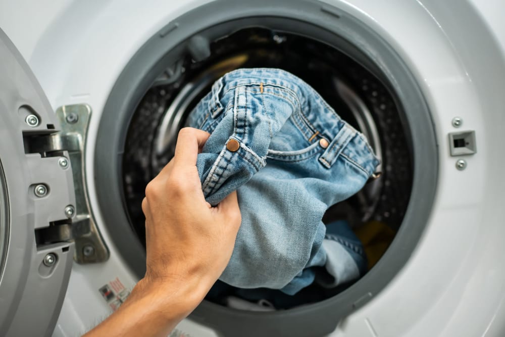 Resident doing laundry at Markwood Apartments in Burlington, Washington