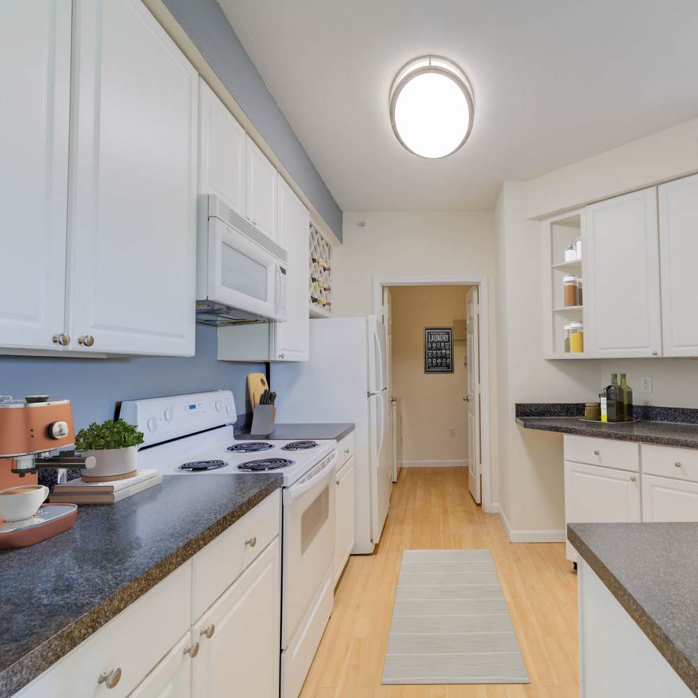 Modern kitchen with sleek countertops and ample storage at Boulder Springs in Maryland Heights, Missouri.