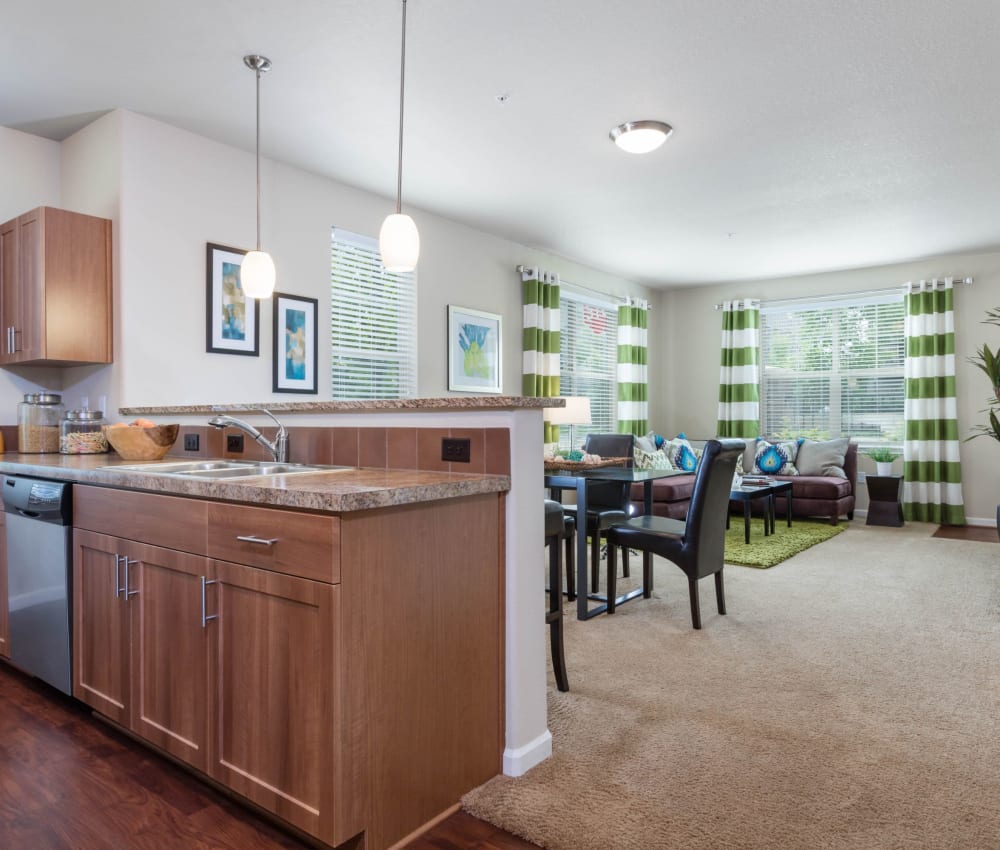 Kitchen with a view of the living room at The Jones in Hillsboro, Oregon
