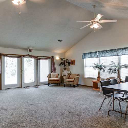 Community space with carpet flooring at Cedar Glen I in Morgantown, West Virginia