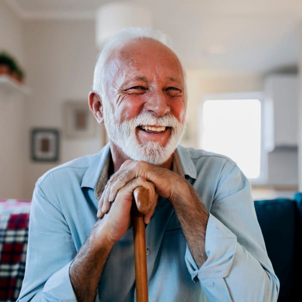 A resident smiles in his apartment at Alate Old Town, Alexandria, Virginia