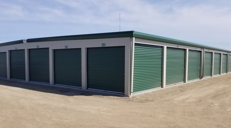 Exterior storage units with green doors at KO Storage in Aberdeen, South Dakota
