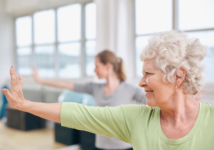 Seniors practicing yoga at Crystal Terrace of Klamath Falls in Klamath Falls, Oregon