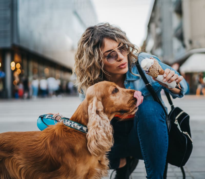 Resident petting her dog outside of Skyline West in Atlanta, Georgia