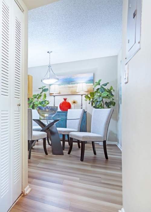 A furnished model bedroom with a ceiling fan at Fairway View in Hialeah, Florida
