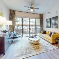 Spacious living room leading out to a balcony at Bellrock Bishop Arts in Dallas, Texas
