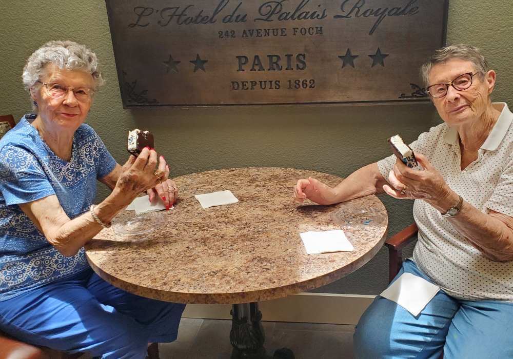 Residents eating ice cream sandwiches at The Pines, A Merrill Gardens Community in Rocklin, California