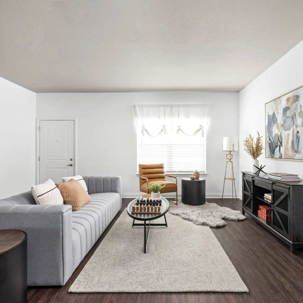 Living room with wood-style flooring Union Club Apartments in Fort Wayne, Indiana