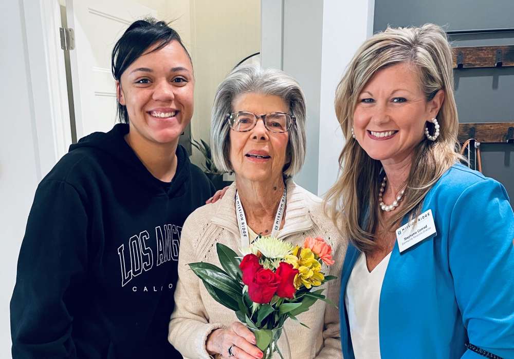 Resident and her caretakers at Mission Ridge in Springfield, Missouri