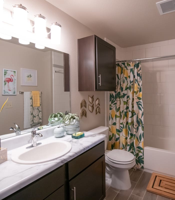 Bathroom with tile flooring at Portico at Friars Creek Apartments in Temple, Texas