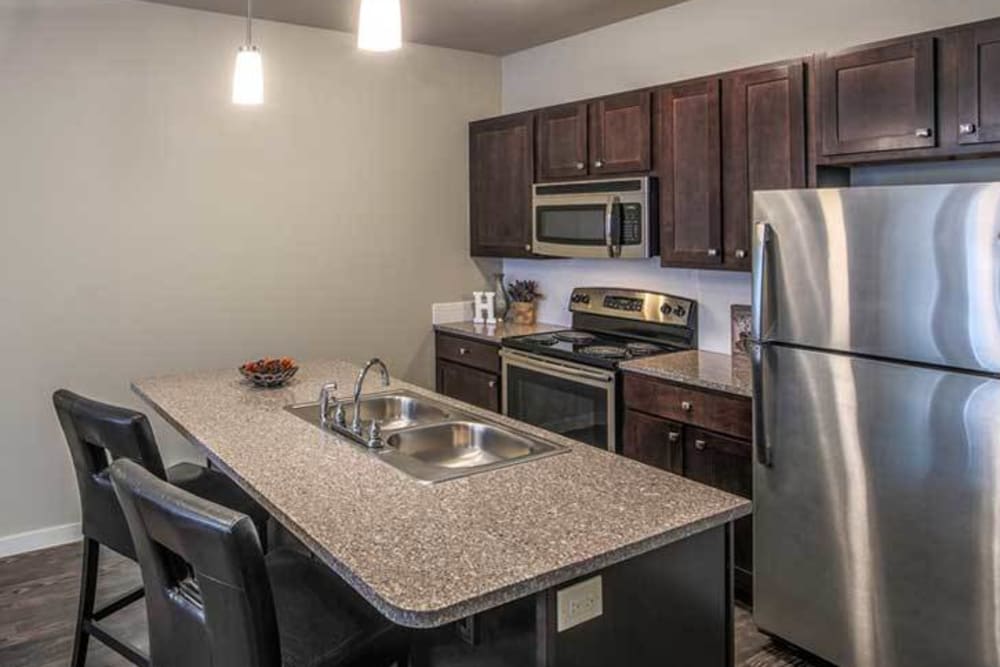 Open kitchen with plenty of cabinet space at Traditions at Mid Rivers in Cottleville, Missouri