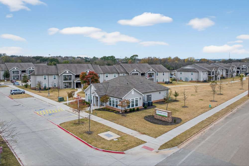 Charming community featuring modern architecture and lush landscaping at Lakewood Crossing in Granbury, Texas.