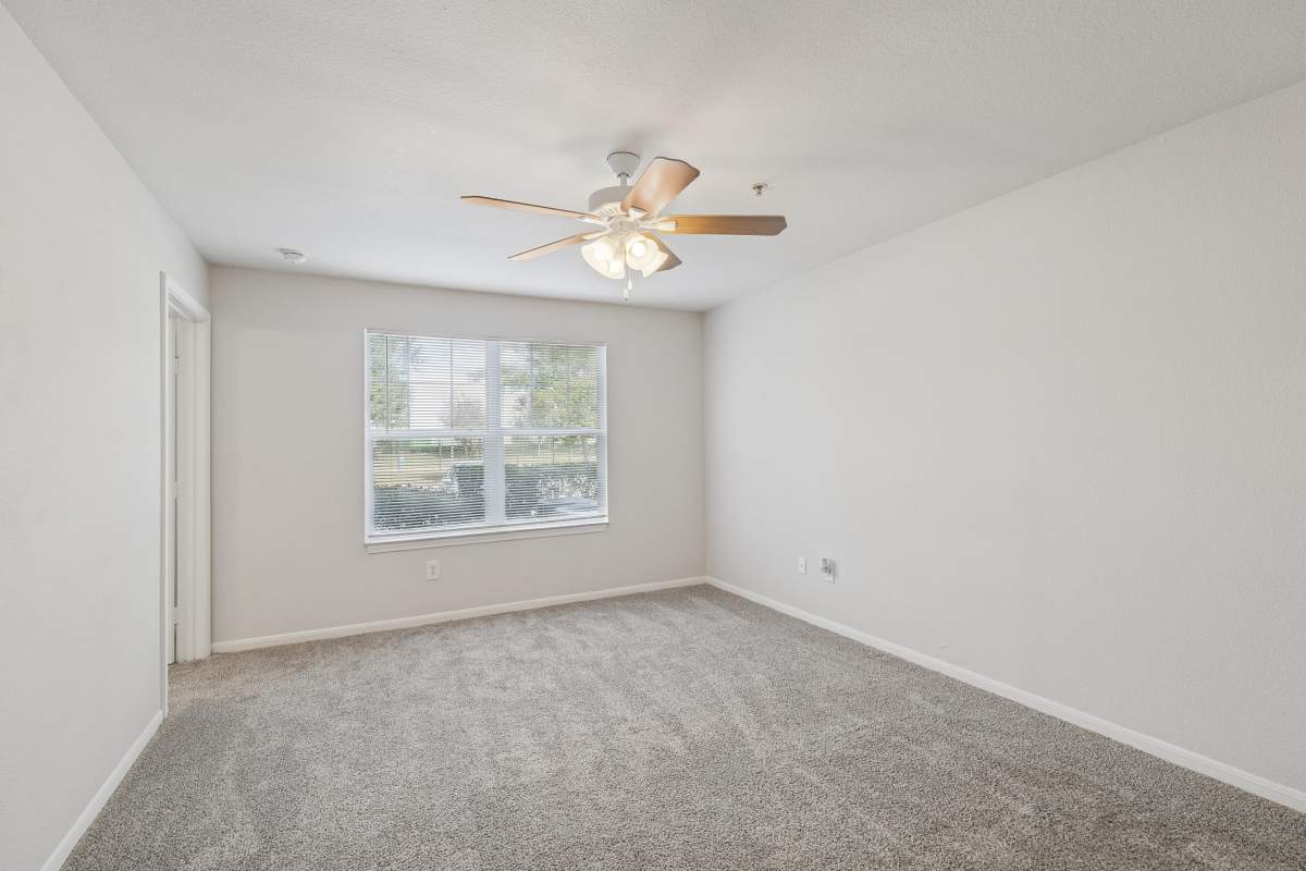 Unfurnished living room with a ceiling fan at Kimberly Pointe in Houston, Texas