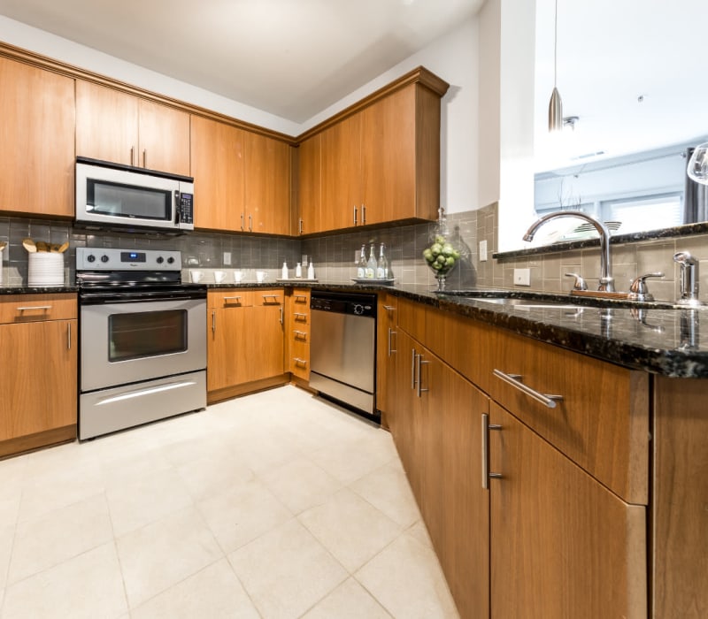 Spacious kitchen with granite countertops and stainless steel appliances at Marq Eight in Atlanta, Georgia