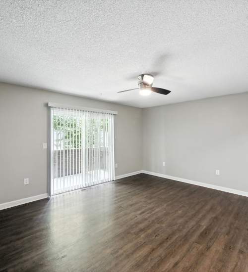 Wood style flooring living area with vaulted ceilings at North River Landing in Elkhart, Indiana