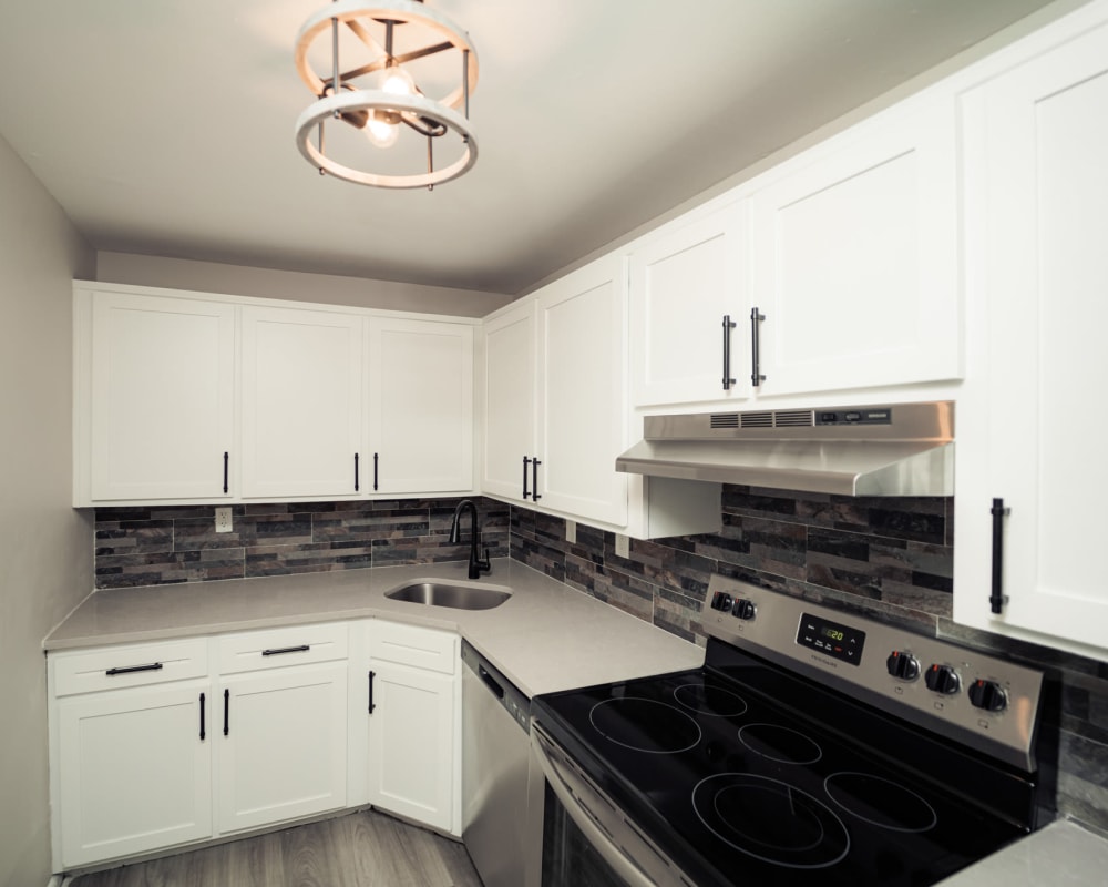 Modern kitchen with stainless-steel appliances at FiveHigh in West Hartford, Connecticut