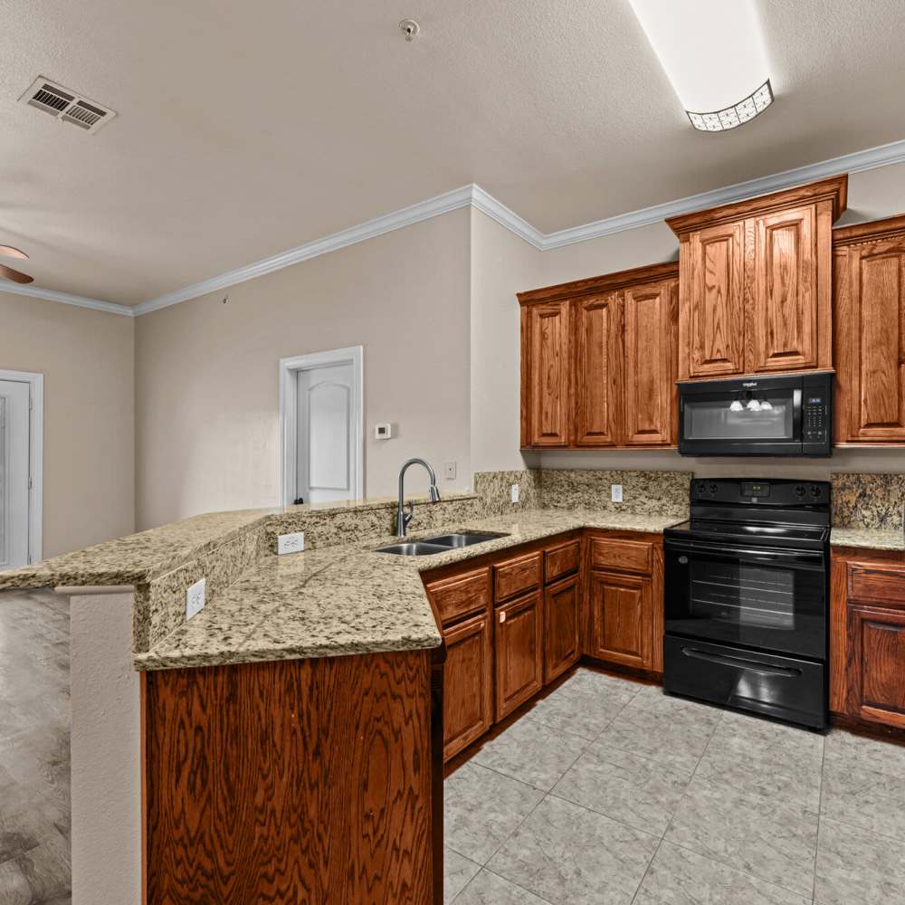 Kitchen with granite counter tops at The Arbors of Mineola in Mineola. TX
