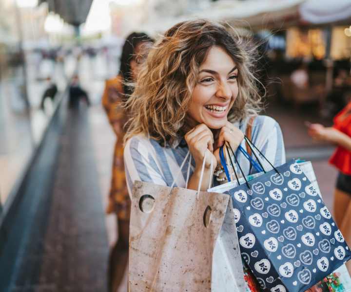 Resident woman carrying shopping bags near Mandolin Terrace in Nashville, Tennessee