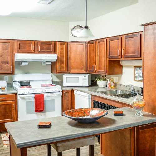Kitchen with wooden cabinets at The Banks At Berkley in Norfolk, Virginia