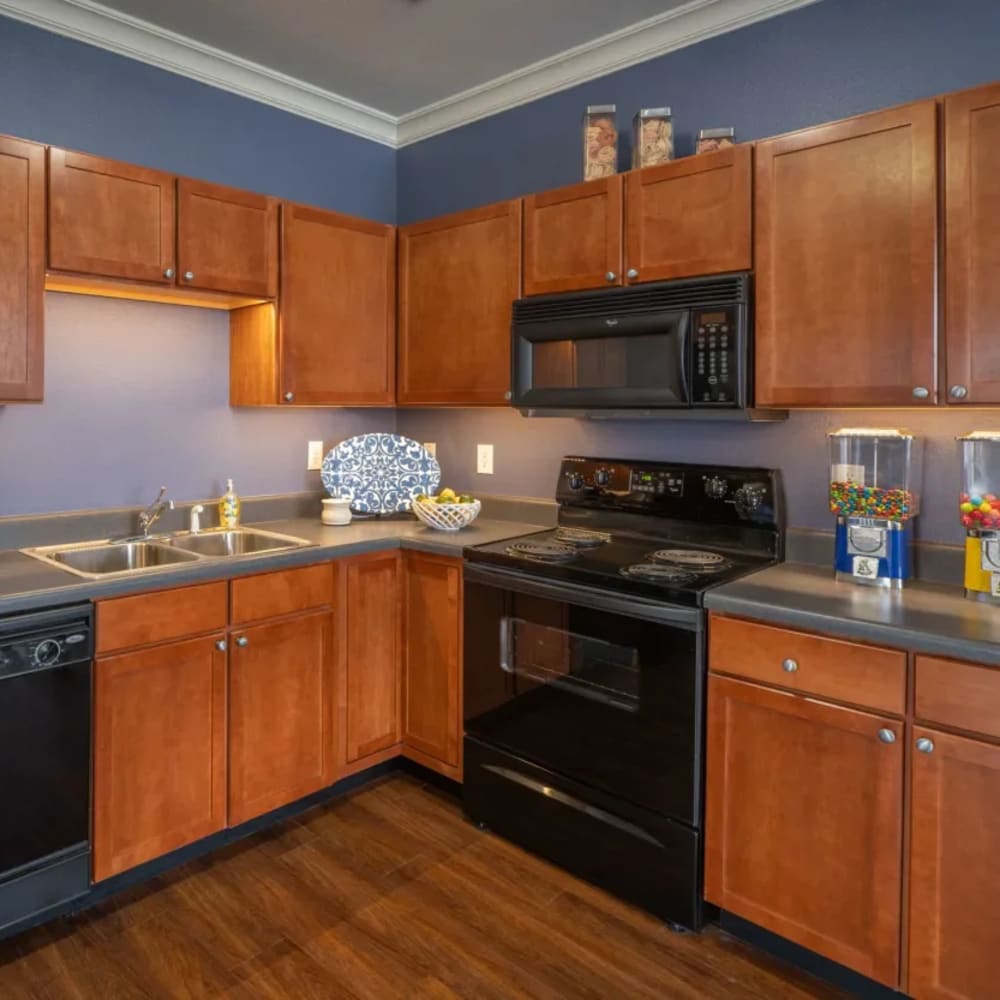 Kitchen with cabinets and appliances at CityView in North Kansas City, Missouri