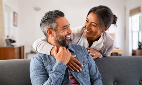 Smiling resident couple in their apartment at The Haylie in Garland, Texas