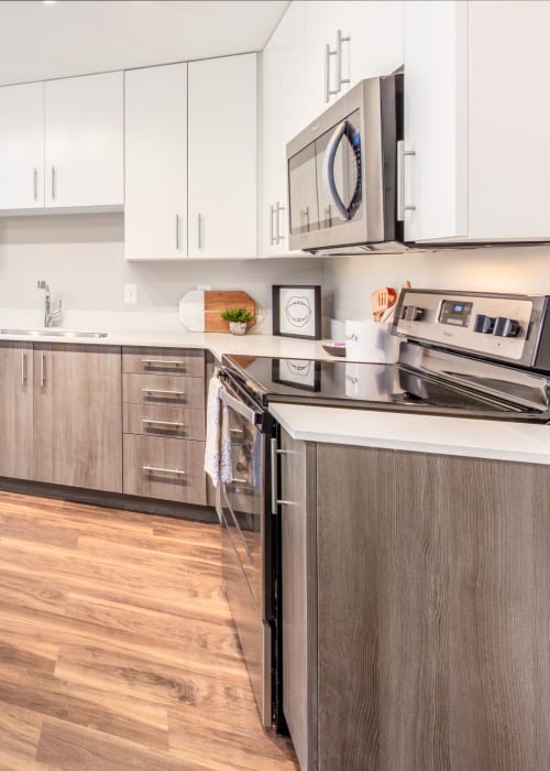Kitchen with stainless steel appliances at RISE at State College in State College, Pennsylvania