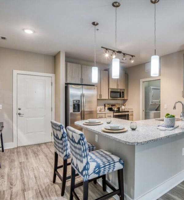 Bar seating at an apartments kitchen island at The Lively Indigo Run in Ladson, South Carolina