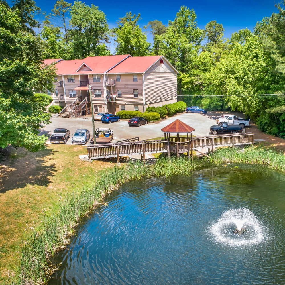 Exterior view of the apatments with a pond nearby at Park Canyon in Dalton, Georgia