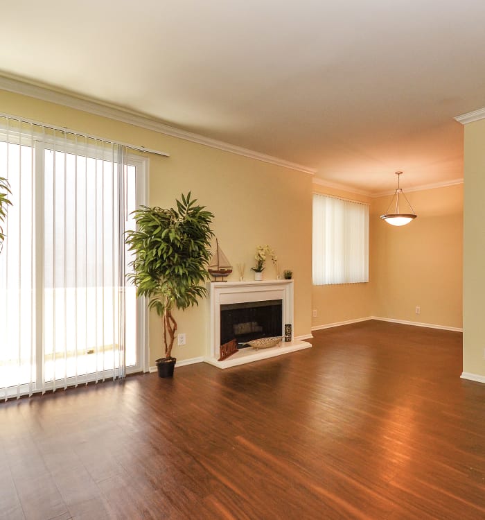 Living room with fireplace and hardwood floors at IMT Beverly Arnaz in Los Angeles, California